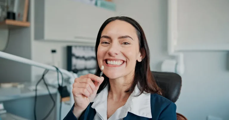 Happy woman, portrait or patient in dental clinic for crown, veneers or medical procedure. Appointment, smile or person with implant in oral exam for dentistry, teeth whitening or cosmetics treatment.