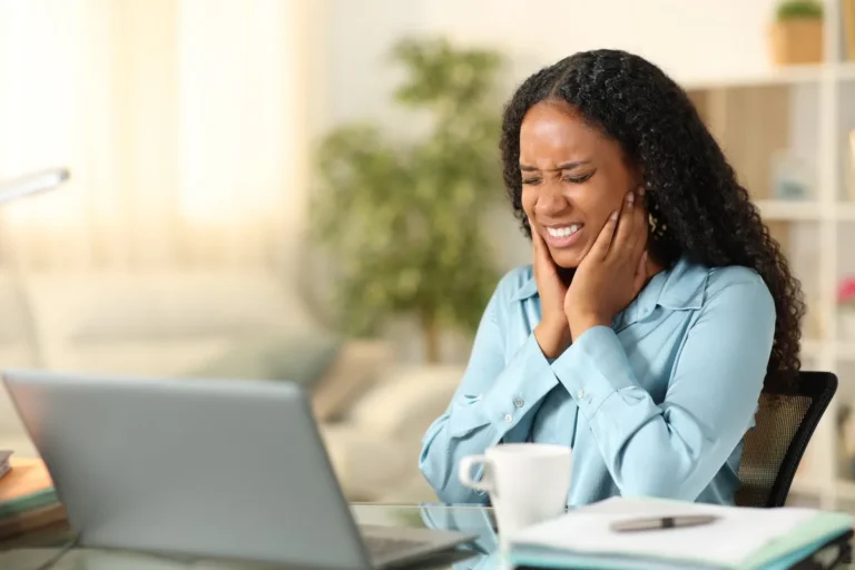 Black self employed suffering tmj tele working at home